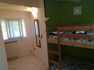 a room with two bunk beds and a window at Guest House Di Bartolomeo in Capaccio-Paestum +11 photos