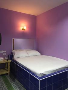 Postel nebo postele na pokoji v ubytování เจิดจรัสรีสอร์ทโรงแรม24ชม