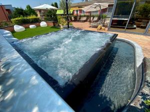 a swimming pool with water in a yard at Admiral Hotel Villa Erme in Desenzano del Garda