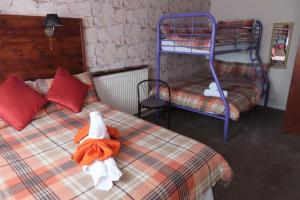 En eller flere senge i et værelse på The Rowan Hotel