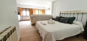 Katil atau katil-katil dalam bilik di Apartamentos Casa Botes II