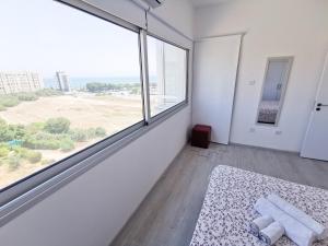 Postel nebo postele na pokoji v ubytování Mackenzie Seaview Paradise