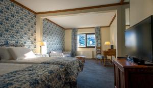 Una cama o camas en una habitación de Las Hayas Ushuaia Resort