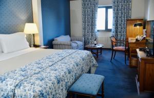 Una cama o camas en una habitación de Las Hayas Ushuaia Resort