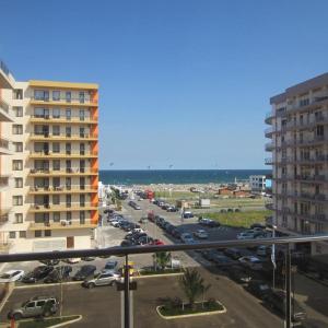 a view of a parking lot with cars and a building at Perfect Spot Summerland Mamaia in Mamaia