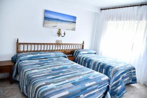 Posteľ alebo postele v izbe v ubytovaní Hotel Maruxa