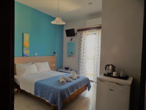 Postel nebo postele na pokoji v ubytování Posidonio Hotel