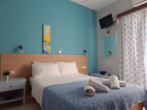 Postel nebo postele na pokoji v ubytování Posidonio Hotel + 37 fotografií