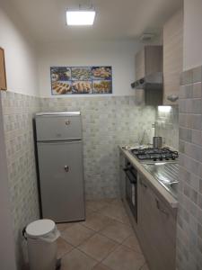 Kuchyň nebo kuchyňský kout v ubytování Lungo Po Appartamento