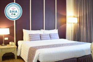 Postel nebo postele na pokoji v ubytování Trang Hotel Bangkok - SHA Plus