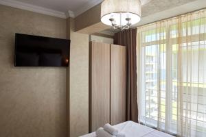 Et tv og/eller underholdning på Berlin luxury apartment Spa n Pool Beach resort