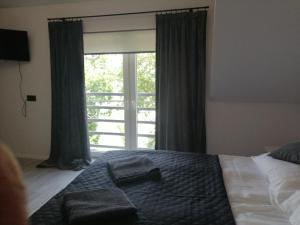 Pokoje i apartamenty MatDar客房内的一张或多张床位