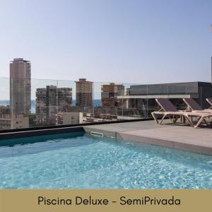 a swimming pool on the roof of a building at Hotel Bristol 4 Sup in Benidorm