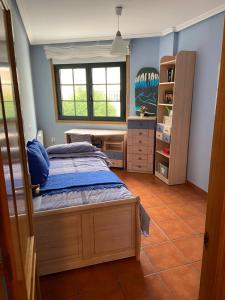 Postel nebo postele na pokoji v ubytování APARTAMENTO PUERTO FOZ