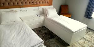 Posteľ alebo postele v izbe v ubytovaní Hotel Sjesta