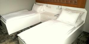 Posteľ alebo postele v izbe v ubytovaní Hotel Sjesta