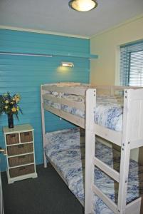 A bed or beds in a room at Aisla Cottage • East Cowes • Isle of Wight