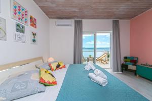 Ένα ή περισσότερα κρεβάτια σε δωμάτιο στο Abuela's Beach House +122 φωτογραφίες