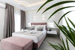 a bedroom with a large bed at Limosa Luxury Residences in Kissamos