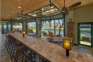a large long table in a room with tables and chairs at The Inn On The River in Pigeon Forge
