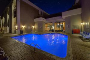a large blue swimming pool at night at The Inn On The River in Pigeon Forge