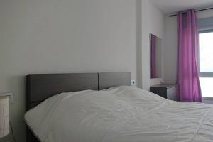 Postel nebo postele na pokoji v ubytování LA MANGA BEACH CLUB RESORT