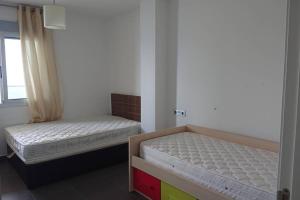 Postel nebo postele na pokoji v ubytování LA MANGA BEACH CLUB RESORT