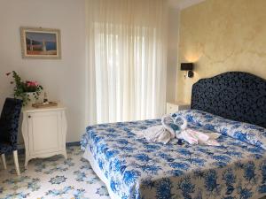 Postel nebo postele na pokoji v ubytování Nonno Francesco B&B