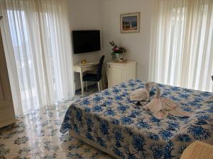 Postel nebo postele na pokoji v ubytování Nonno Francesco B&B
