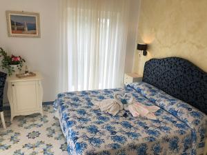 Postel nebo postele na pokoji v ubytování Nonno Francesco B&B