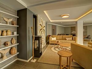 a living room with a couch and a table at Atlantic Garden Boutique Hotel in Swakopmund