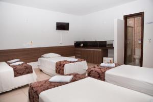 Ένα ή περισσότερα κρεβάτια σε δωμάτιο στο Hotel Belugi