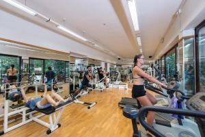 a group of people exercising in a gym at Buona Mobile Homes on Camping Mare e Pineta in Lido di Spina
