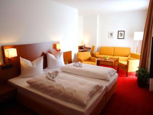 Postel nebo postele na pokoji v ubytování Hotel Gasthof Posthalter + 31 fotografií