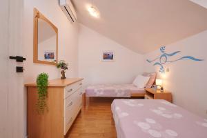 Posteľ alebo postele v izbe v ubytovaní Apartment Ana-Marija
