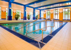a large swimming pool in a hotel room at Spa Hotel Imperial in Karlovy Vary