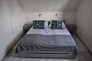 Postel nebo postele na pokoji v ubytování Domki Magnati