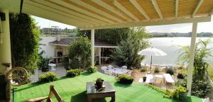 a patio with a view of the water at Vila Zuzette in Constanţa