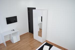 TV a/nebo společenská místnost v ubytování White Hotel
