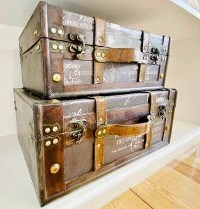 a stack of suitcases stacked on top of each other at The Postcard Avenue in Lisbon