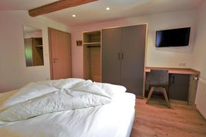 Ένα ή περισσότερα κρεβάτια σε δωμάτιο στο Haus Tusculum