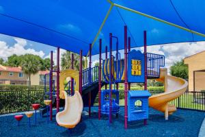 a playground with a slide and slides at FantasyWorld Resort in Kissimmee