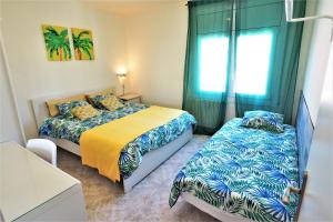Posteľ alebo postele v izbe v ubytovaní MARILU SEAVIEW & BEACH - apartment