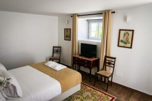 En eller flere senge i et værelse på Quinta Pedra Firme