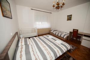Postel nebo postele na pokoji v ubytování Apartman Kuća 150