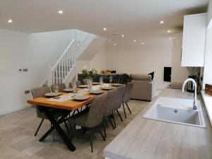 a kitchen and dining room with a table and chairs at The Old Bakery - 11B in Berkeley