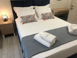 Krevet ili kreveti u jedinici u objektu PORTO PORTES suites