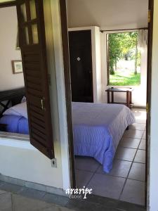 En eller flere senge i et værelse på Araripe Lodge