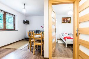 Posteľ alebo postele v izbe v ubytovaní Apartamenty "Zielony Zakątek" Olcza Zakopane