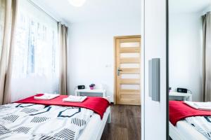 Posteľ alebo postele v izbe v ubytovaní Apartamenty "Zielony Zakątek" Olcza Zakopane